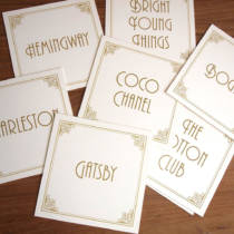 Table name cards featuring names from the Art Deco era