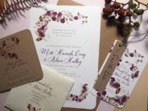 A wedding invitation set in a rustic blackberry design