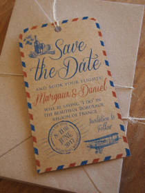 an airmail style save the date on rustic kraft paper