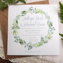 A rustic wedding invitation desion with botanical elements