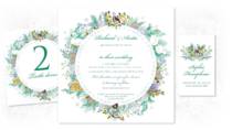 A Christmas wedding invitation with a botanical wreath design