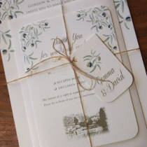 A invitation bundle with rsvp and envelope for a wedding abroad on the Italian Lakes