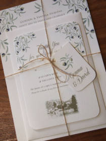 A invitation bundle with rsvp and envelope for a wedding abroad on the Italian Lakes