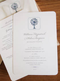 A winter wedding invitation featuring a partridge in a pear tree design