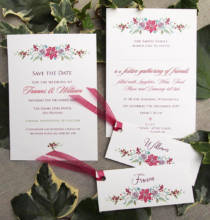 Winter wedding stationery set with a red and green poinsettia design